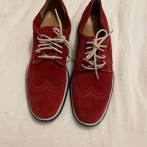 Like new but never worn, reddish color with cream she string.